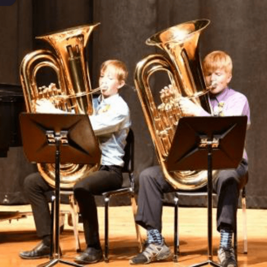 Two young boys play duo tubas. Honors Concert Performance at the Bowen Young Musicians Festival
